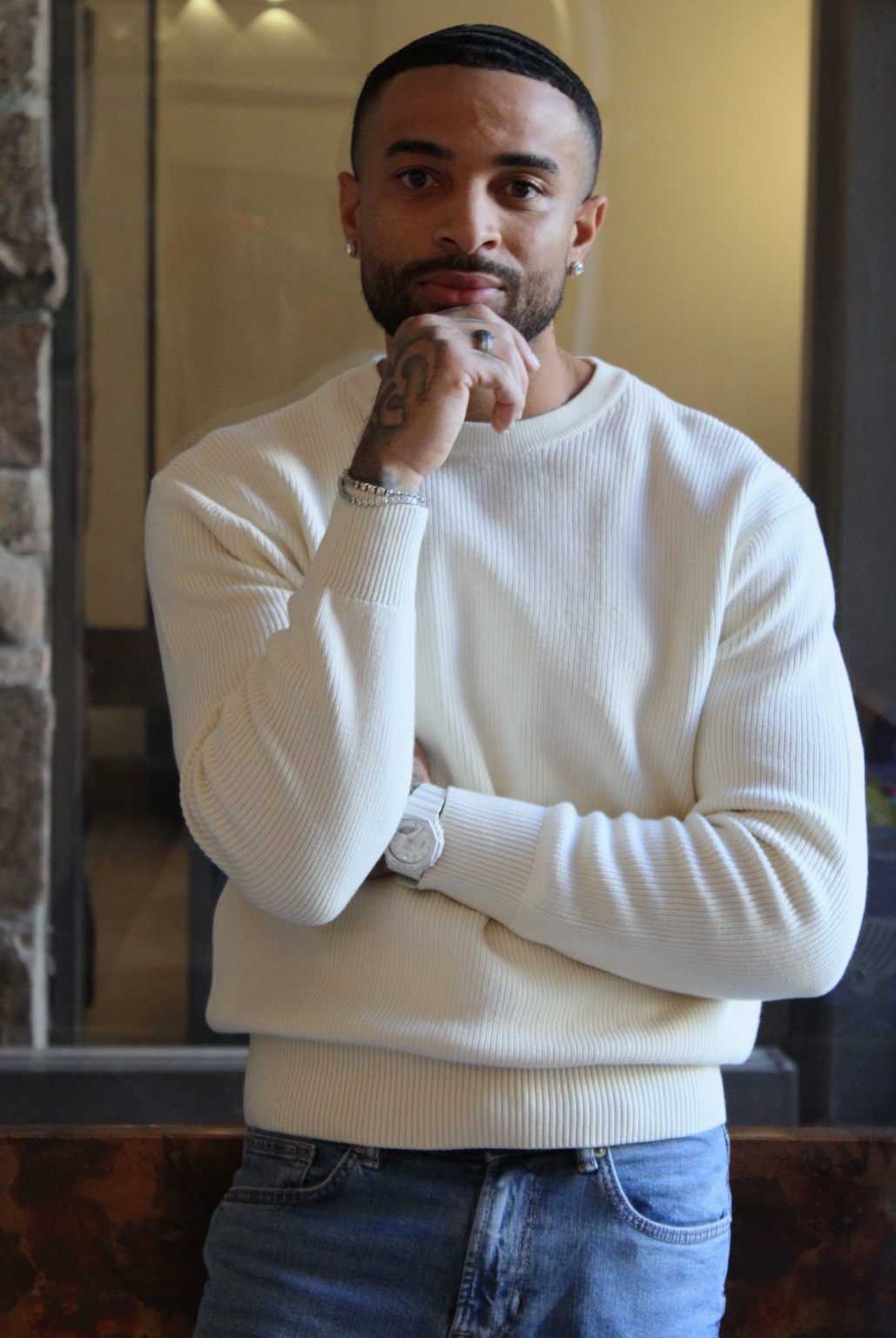 James Muhammad commercial portrait in a cream sweater